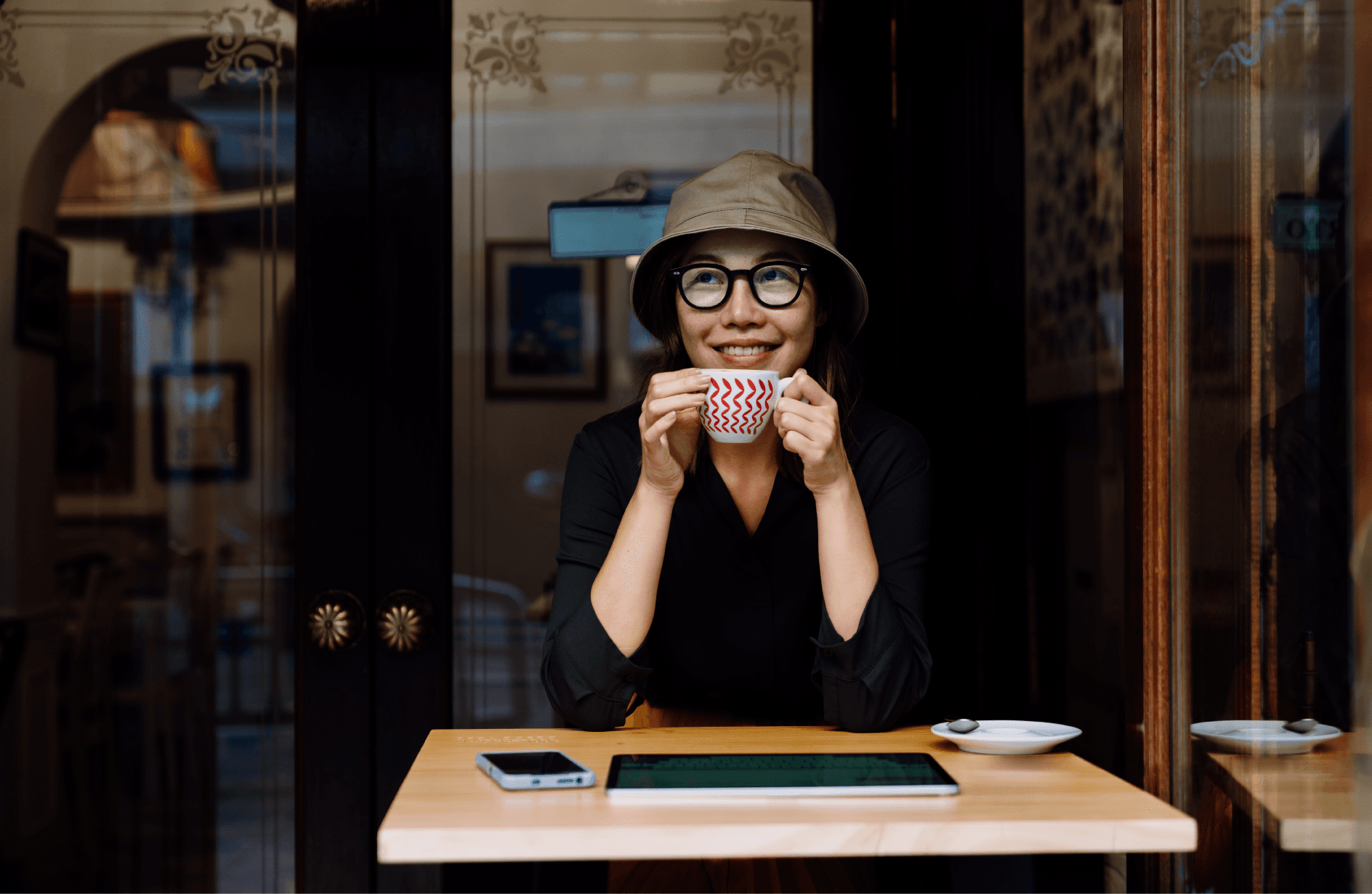 A café customer enjoying a cup of coffee